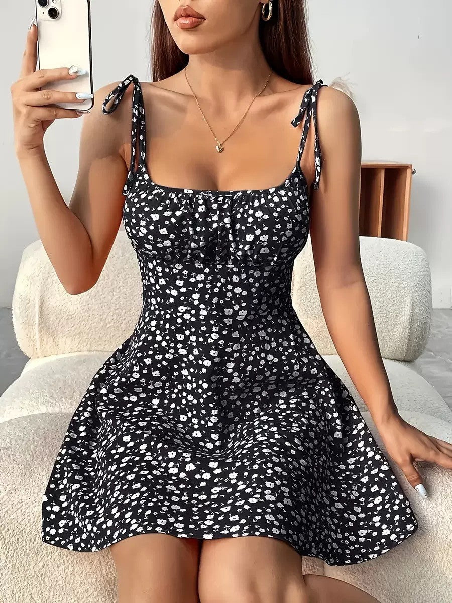 Gocrisandy floral print summer A-line dress with waist trimming, casual and slimming fit, worn by a model outdoors.